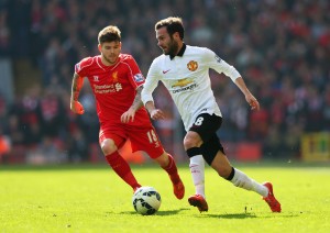 LIVERPOOL, ENGLAND - MARCH 22: Juan Mata of Manchester United is closed down by Alberto Moreno of Liverpool during the Barclays Premier League match between Liverpool and Manchester United at Anfield on March 22, 2015 in Liverpool, England. (Photo by Alex Livesey/Getty Images)