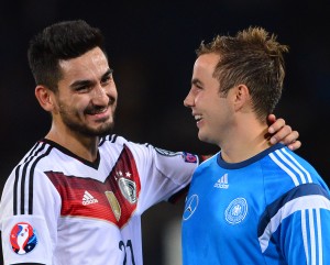 GLASGOW, SCOTLAND - SEPTEMBER 7 : Ilkay Gundogan and Mario Gotze of Germany celebrate at the final whistle during the EURO 2016 Qualifier between Scotland and Germany at Hamden Park on September 7, 2015 in Glasgow, Scotland. (Photo by Mark Runnacles/Getty Images)