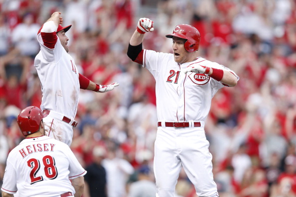 CINCINNATI, OH - MAY 4: Todd Frazier #21 of the Cincinnati Reds celebrates his winning hit with teammate Joey Votto #19 following the game against the Milwaukee Brewers at Great American Ball Park on May 4, 2014 in Cincinnati, Ohio. The Reds won 4-3 in ten innings. (Photo by Joe Robbins/Getty Images)