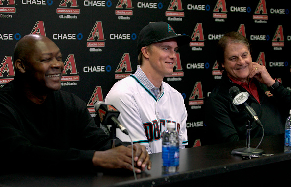 PHOENIX, AZ - DECEMBER 11:  Free agent aquisition Zack Greinke of the Arizona Diamondbacks (C) laughs with Chief Baseball Officer Tony La Russa (R) and General Manager Dave Stewart during a press conference at Chase Field on December 11, 2015 in Phoenix, Arizona.  (Photo by Ralph Freso/Getty Images)