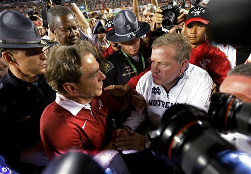 Alabama head coach Nick Saban shakes hands with Notre Dame head coach Brian Kelly after the BCS National Championship college football game Monday, Jan. 7, 2013, in Miami. Alabama won 42-14. (AP Photo/David J. Phillip)