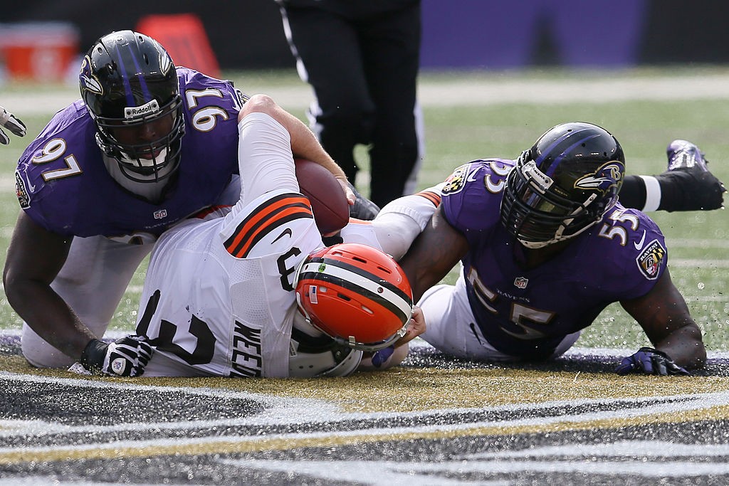 BALTIMORE, MD - SEPTEMBER 15: Arthur Jones #97 and Terrell Suggs #55 of the Baltimore Ravens sack quarterback Brandon Weeden #3 of the Cleveland Browns during the second half of the Ravens 14-6 win at M&T Bank Stadium on September 15, 2013 in Baltimore, Maryland.  (Photo by Rob Carr/Getty Images)