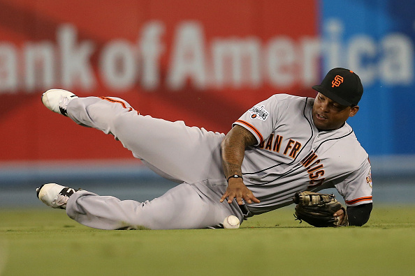 LOS ANGELES, CA - SEPTEMBER 01: Right fielder Marlon Byrd #6 of the San Francisco Giants reaches for the ball after failing to make a sliding catch on a single hit by A.J. Ellis of the Los Angeles Dodgers in the second inning at Dodger Stadium on September 1, 2015 in Los Angeles, California (Photo by Stephen Dunn/Getty Images)