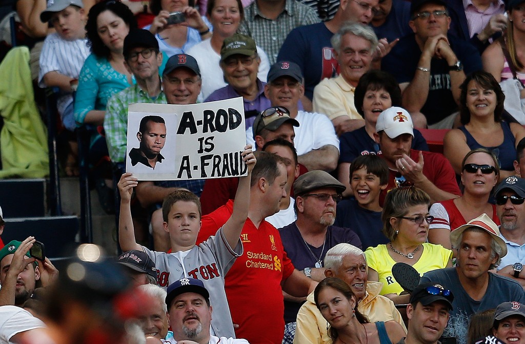 BOSTON, MA - AUGUST 17:  A fan holds a sign critical of Alex Rodriguez #13 of the New York Yankees during a game with the Boston Red Sox at Fenway Park on August 17, 2013 in Boston, Massachusetts. (Photo by Jim Rogash/Getty Images)