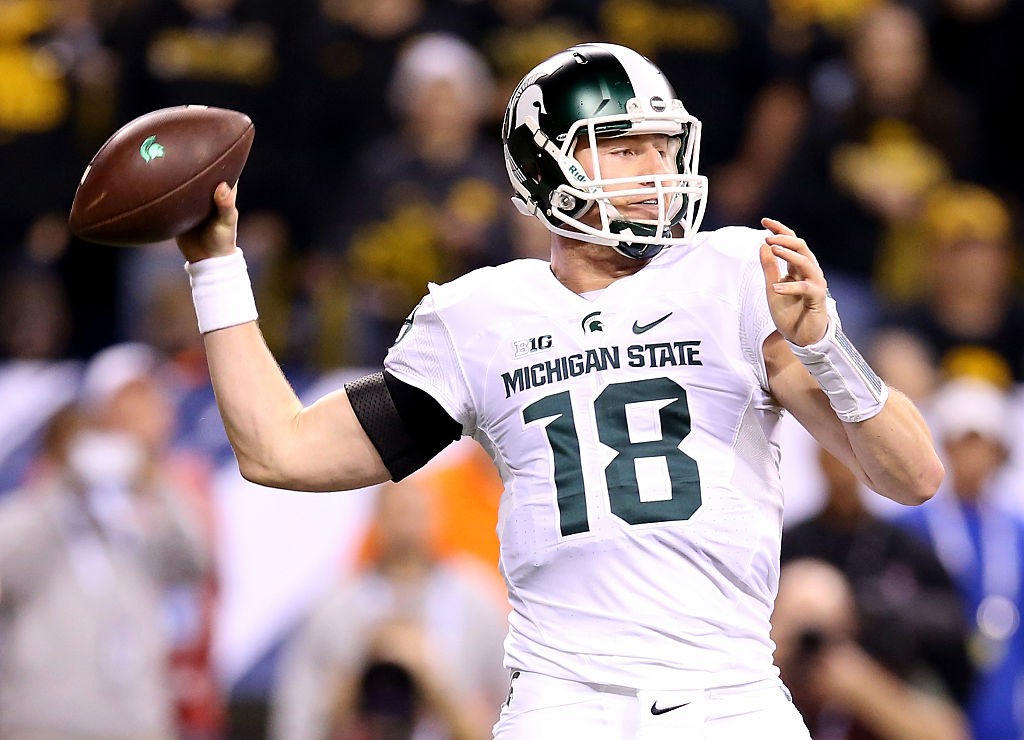 INDIANAPOLIS, IN - DECEMBER 05:  Connor Cook #18 of the Michigan State Spartans throws against the Iowa Hawkeyes in the Big Ten Championship at Lucas Oil Stadium on December 5, 2015 in Indianapolis, Indiana.  (Photo by Andy Lyons/Getty Images)