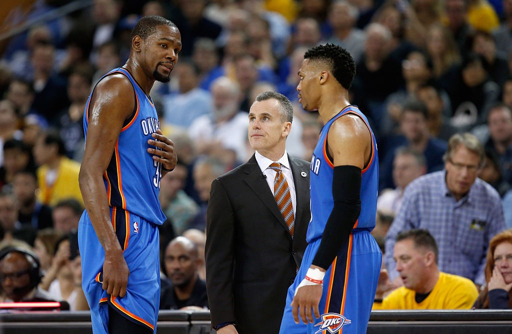 OAKLAND, CA - MARCH 03: Kevin Durant #35 and Russell Westbrook #0 of the Oklahoma City Thunder talk to head coach Billy Donovan during their game against the Golden State Warriors at ORACLE Arena on March 3, 2016 in Oakland, California. (Photo by Ezra Shaw/Getty Images)