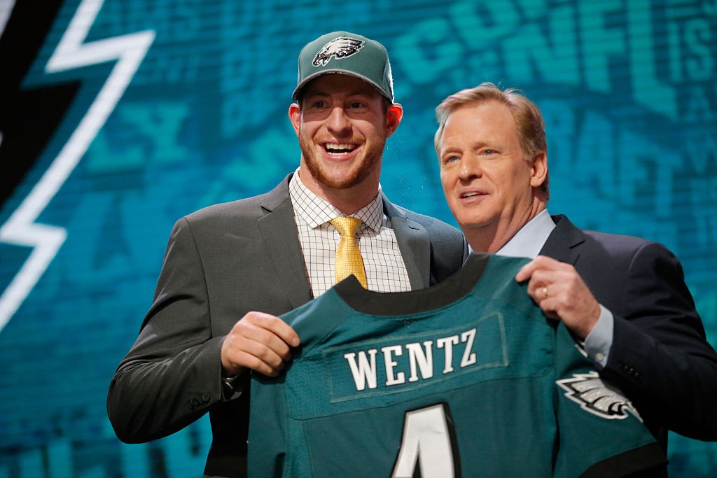 CHICAGO, IL - APRIL 28: (L-R) Carson Wentz of the North Dakota State Bison holds up a jersey with NFL Commissioner Roger Goodell after being picked #2 overall by the Philadelphia Eagles during the first round of the 2016 NFL Draft at the Auditorium Theatre of Roosevelt University on April 28, 2016 in Chicago, Illinois. (Photo by Jon Durr/Getty Images)