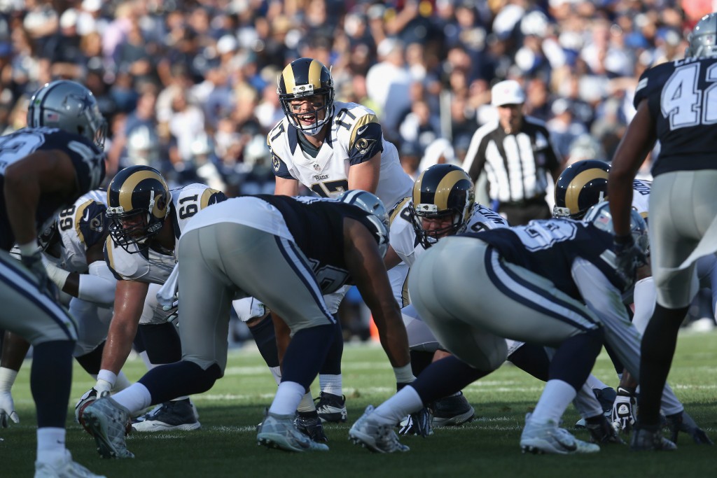 LOS ANGELES, CALIFORNIA - AUGUST 13:  Quarterback Case Keenum #17 of the Los Angeles Rams calls signals against the Dallas Cowboys at the Los Angeles Coliseum during preseason on August 13, 2016 in Los Angeles, California.  (Photo by Stephen Dunn/Getty Images)