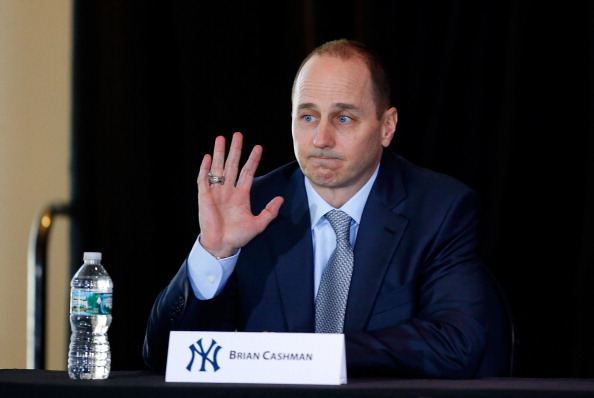 NEW YORK, NY - FEBRUARY 11:  General Manager Brian Cashman of the New York Yankees looks on during a news conference introducing Masahiro Tanaka (not pictured) to the media on February 11, 2014 at Yankee Stadium in the Bronx borough of New York City.  (Photo by Jim McIsaac/Getty Images)