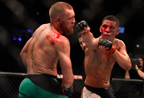 LAS VEGAS, NV - AUGUST 20:  (R-L) Nate Diaz punches Conor McGregor of Ireland in their welterweight bout during the UFC 202 event at T-Mobile Arena on August 20, 2016 in Las Vegas, Nevada. (Photo by Jeff Bottari/Zuffa LLC/Zuffa LLC via Getty Images)
