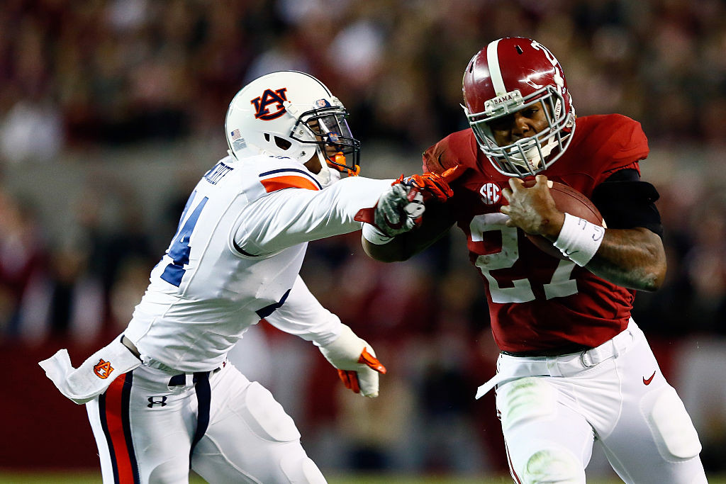 TUSCALOOSA, AL - NOVEMBER 29: Derrick Henry #27 of the Alabama Crimson Tide runs the ball in the fourth quarter against the Auburn Tigers during the Iron Bowl at Bryant-Denny Stadium on November 29, 2014 in Tuscaloosa, Alabama. (Photo by Kevin C. Cox/Getty Images)