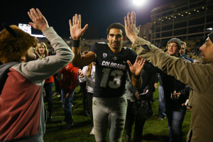 BOULDER, CO - NOVEMBER 19:  quarterback Sefo Liufau #13 of the Colorado Buffaloes celebrates on the field with fans after defeating the Washington State Cougars 38-24 at Folsom Field on November 19, 2016 in Boulder, Colorado. (Photo by Justin Edmonds/Getty Images)