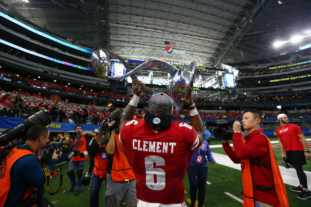 ARLINGTON, TX - JANUARY 02:  Corey Clement #6 of the Wisconsin Badgers holds up the trophy after a 24-16 win against the Western Michigan Broncos during the Goodyear Cotton Bowl Classic at AT&T Stadium on January 2, 2017 in Arlington, Texas.  (Photo by Ronald Martinez/Getty Images)