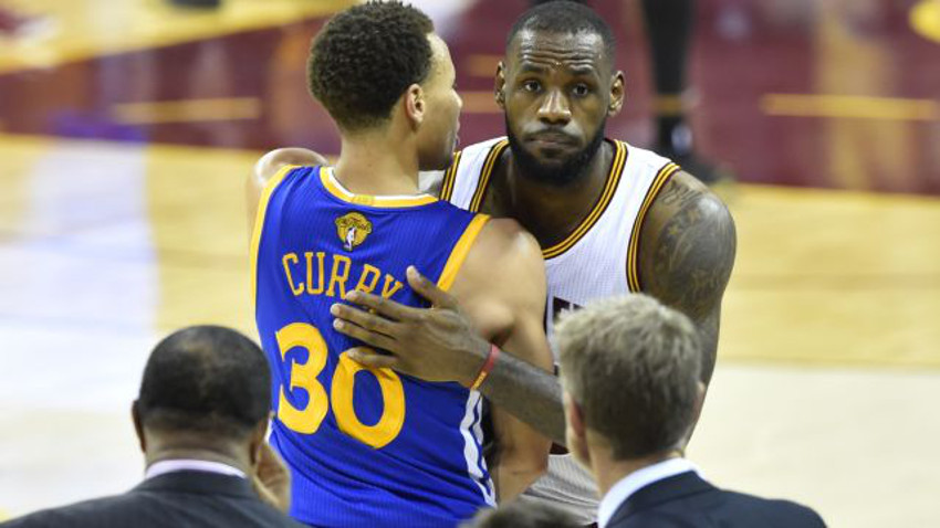 Steph Curry and LeBron James share a Game Five hug.