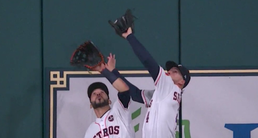 George Springer lept over his teammate for a great catch.