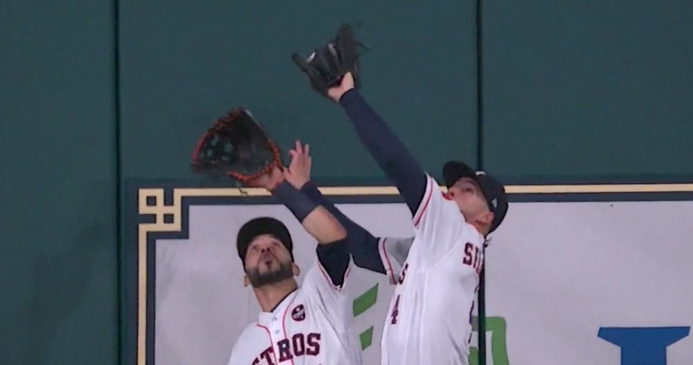 George Springer lept over his teammate for a great catch.