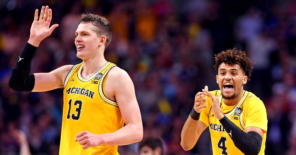 Michigan players Moritz Wagner (L) and Isaiah Livers celebrate against Loyola-Chicago.