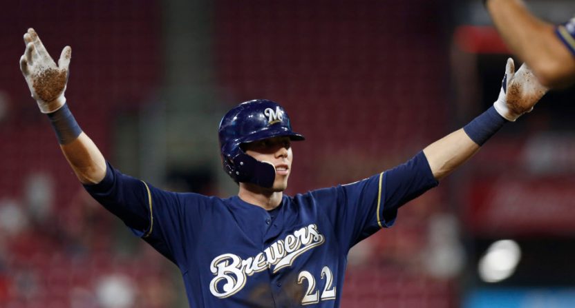 Christian Yelich celebrates his RBI triple that completed his cycle Wednesday.