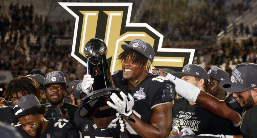 UCF (seen celebrating the AAC championship)'s game against LSU may determine if the AAC or the SEC has the top bowl game record this year.