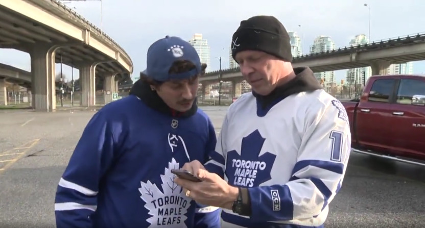A pair of Leafs' fans finding out their game was postponed.