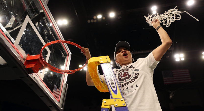 Dawn Staley cuts down the nets after South Carolina's 2022 title win.