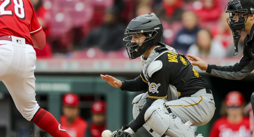 Josh VanMeter catching for the Pirates against the Reds.