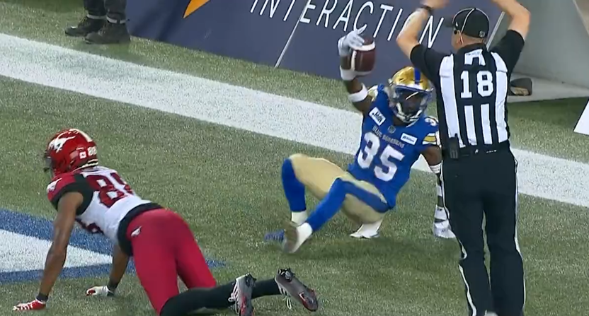 Demerio Houston of the Winnipeg Blue Bombers makes a wild interception in a July 15, 2022 game.