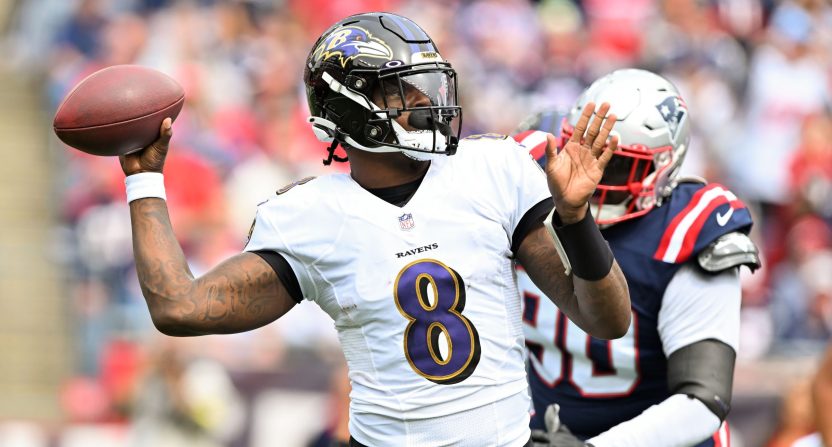 Lamar Jackson throws a pass in the Baltimore Ravens' game against the New England Patriots.