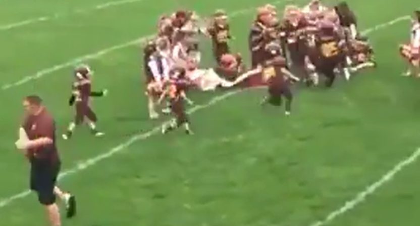 A youth football team tried to take the field by running through a sign. While the enthusiasm was there, the execution was not.