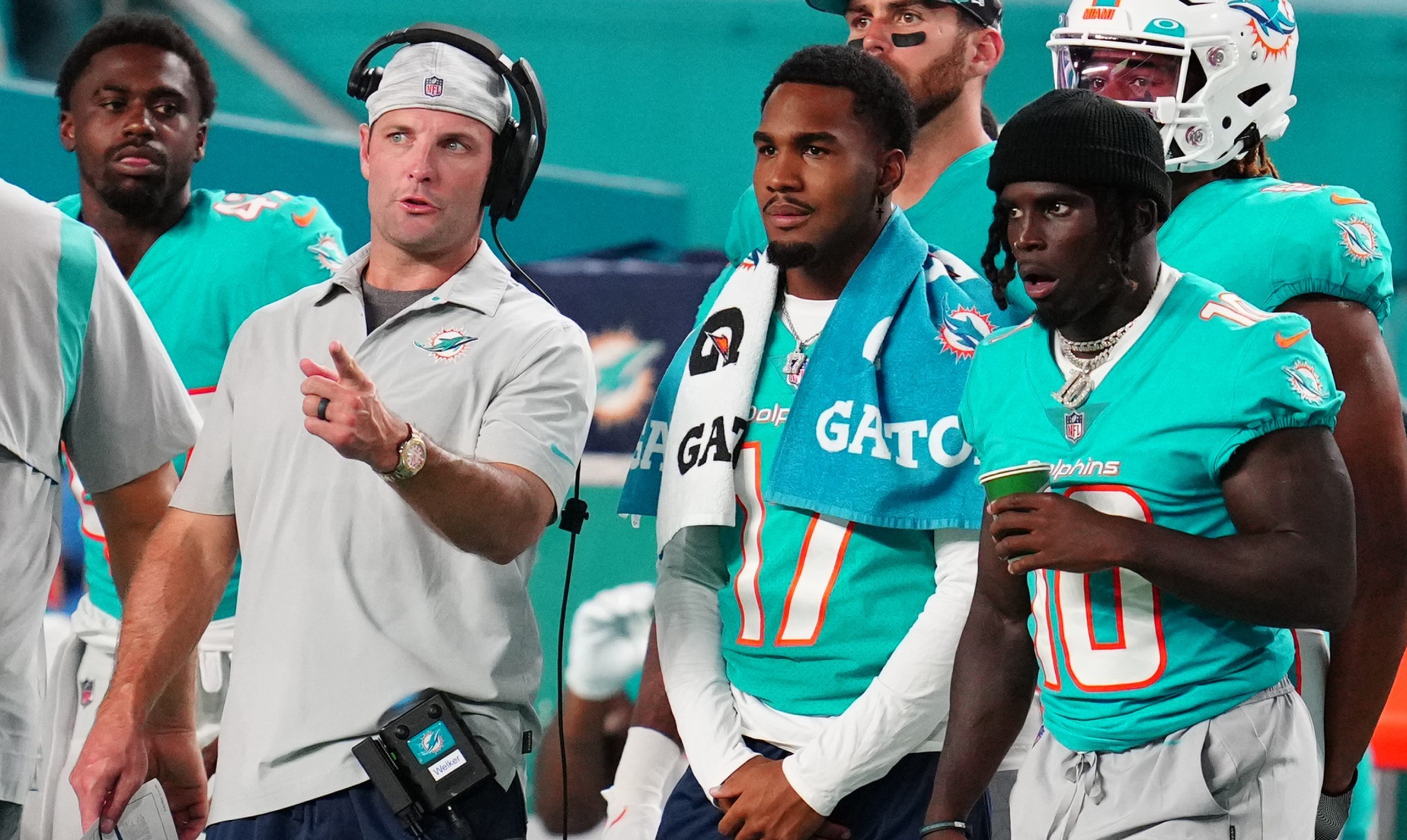Miami Dolphins star wide receivers Jaylen Waddle and Tyreek Hill on the sideline.