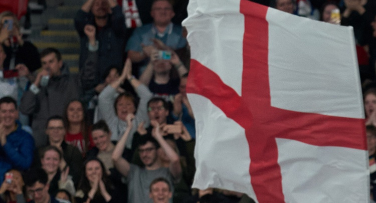 Fans with an England flag at an Oct. 7 England women's match against the USWNT.