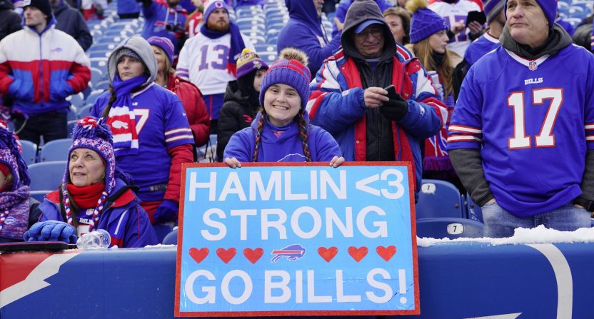 Orchard Park, NY, USA; Buffalo Bills fans cheer and hold a sign in support of safety Damar Hamlin