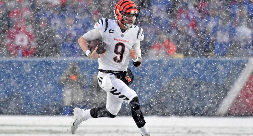 Jan 22, 2023; Orchard Park, New York, USA; Cincinnati Bengals quarterback Joe Burrow (9) runs with the ball against the Buffalo Bills during the second quarter of an AFC divisional round game at Highmark Stadium. Mandatory Credit: Mark Konezny-USA TODAY Sports