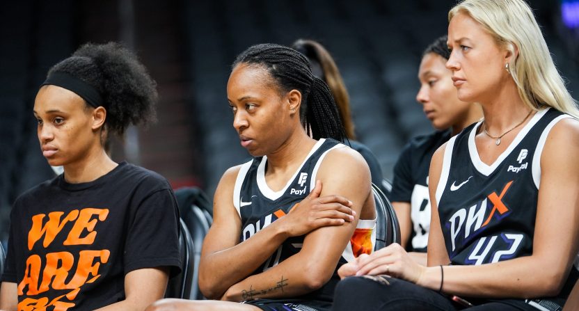 From left, Brianna Turner, Shey Peddy, and Sophie Cunningham listen as Imani McGee-Stafford speaks to attendees during a rally for Brittney Griner's release at the Footprint Center on July 6, 2022, in Phoenix.