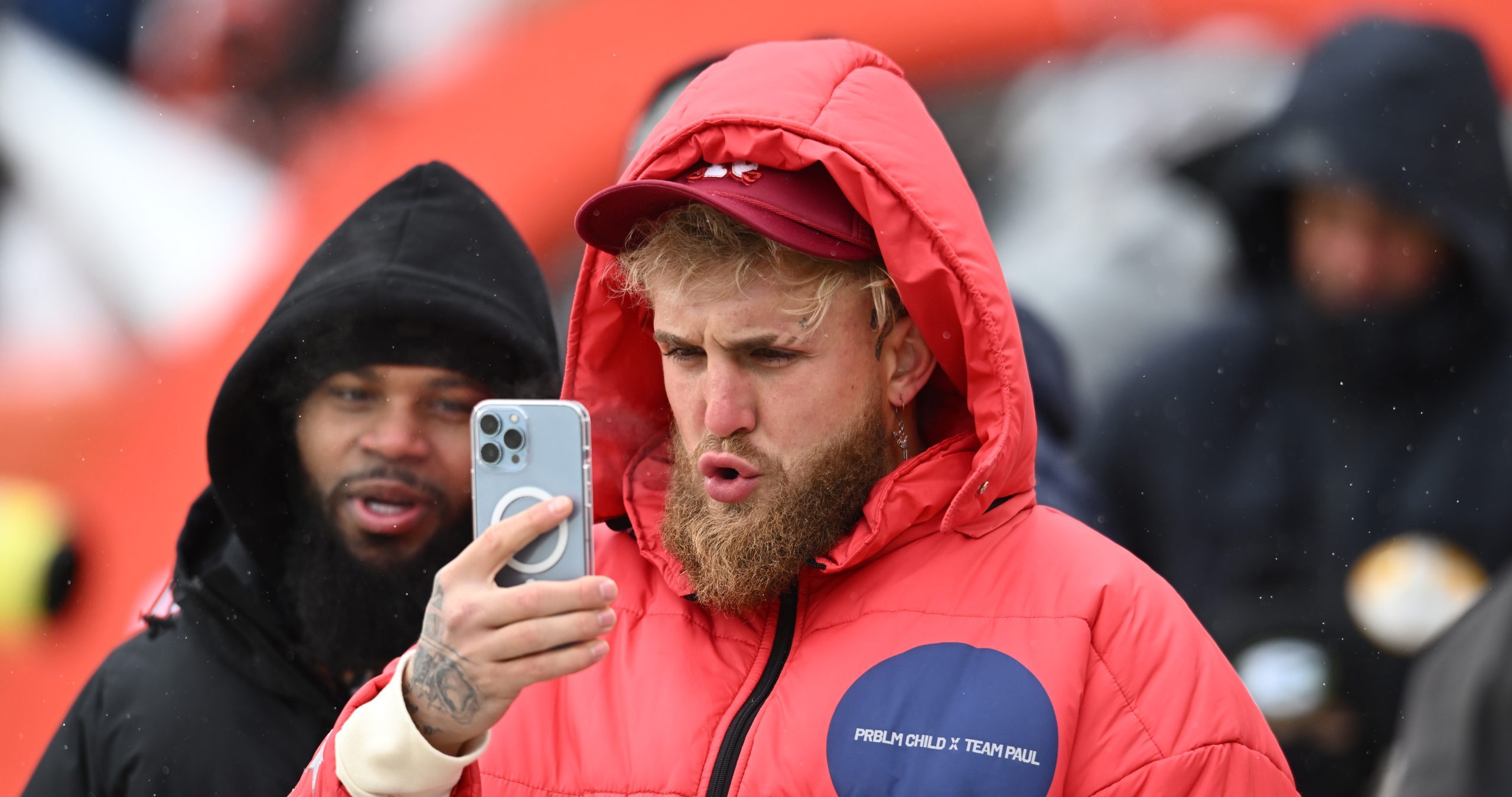 Dec 24, 2022; Cleveland, Ohio, USA; Jake Paul records a video on the field before the game between the Cleveland Browns and the New Orleans Saints at FirstEnergy Stadium. Mandatory Credit: Ken Blaze-USA TODAY Sports