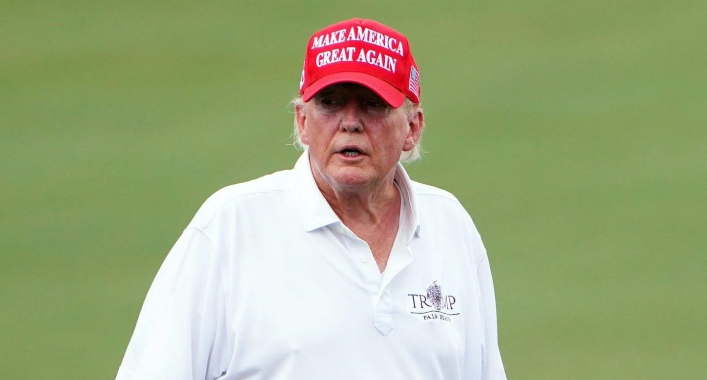 Oct 27, 2022; Miami, Florida, USA; Former President Donald Trump walks onto the 18th green during the Pro-Am tournament before the LIV Golf series at Trump National Doral. Mandatory Credit: John David Mercer-USA TODAY Sports