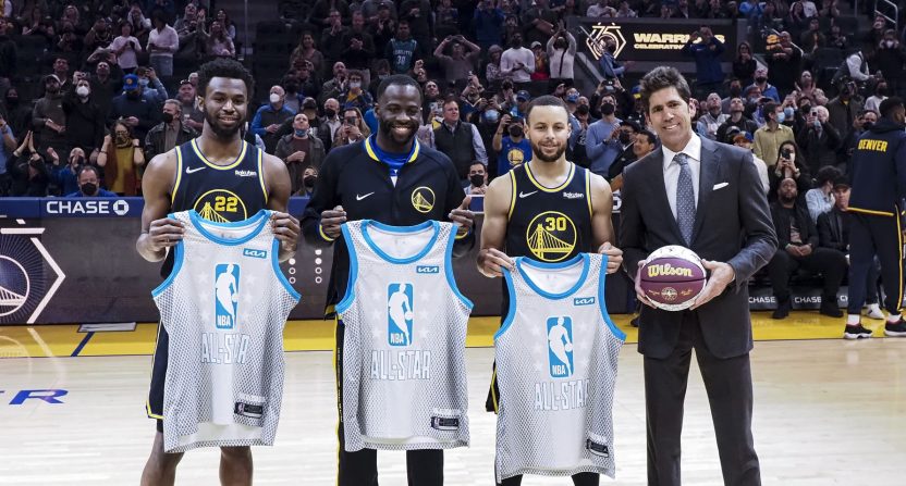 Golden State Warriors forward Andrew Wiggins (22), forward Draymond Green (23) and guard Stephen Curry (30) are presented their all star jerseys by general manager Bob Myers