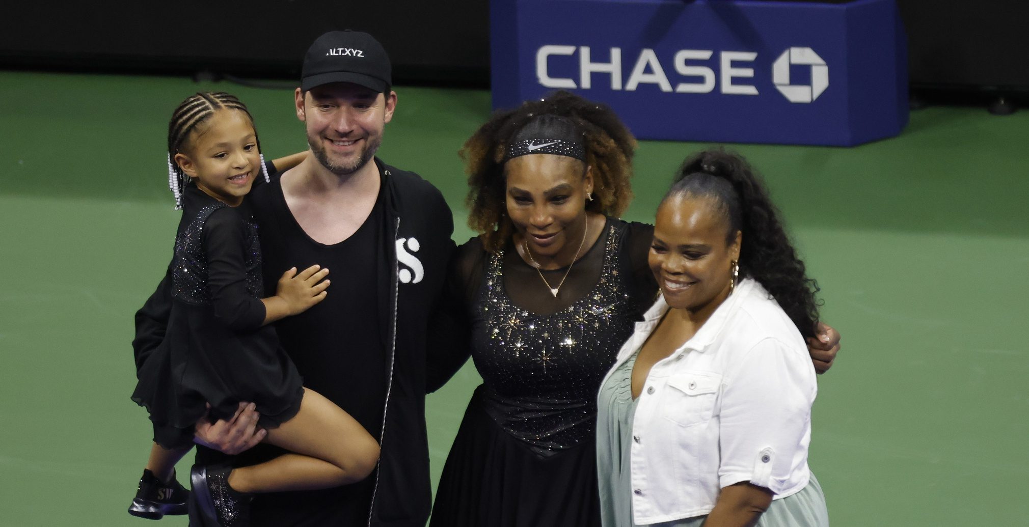 Serena Williams (USA) (M-L) poses for a picture with daughter Olympia (L), husband Alexis Ohanian (M-L), and sister Isha Price (R) after a ceremony honoring her career after her match against Danka Kovinic (MNE) (not pictured) on day one of the 2022 U.S. Open tennis tournament at USTA Billie Jean King National Tennis Center.