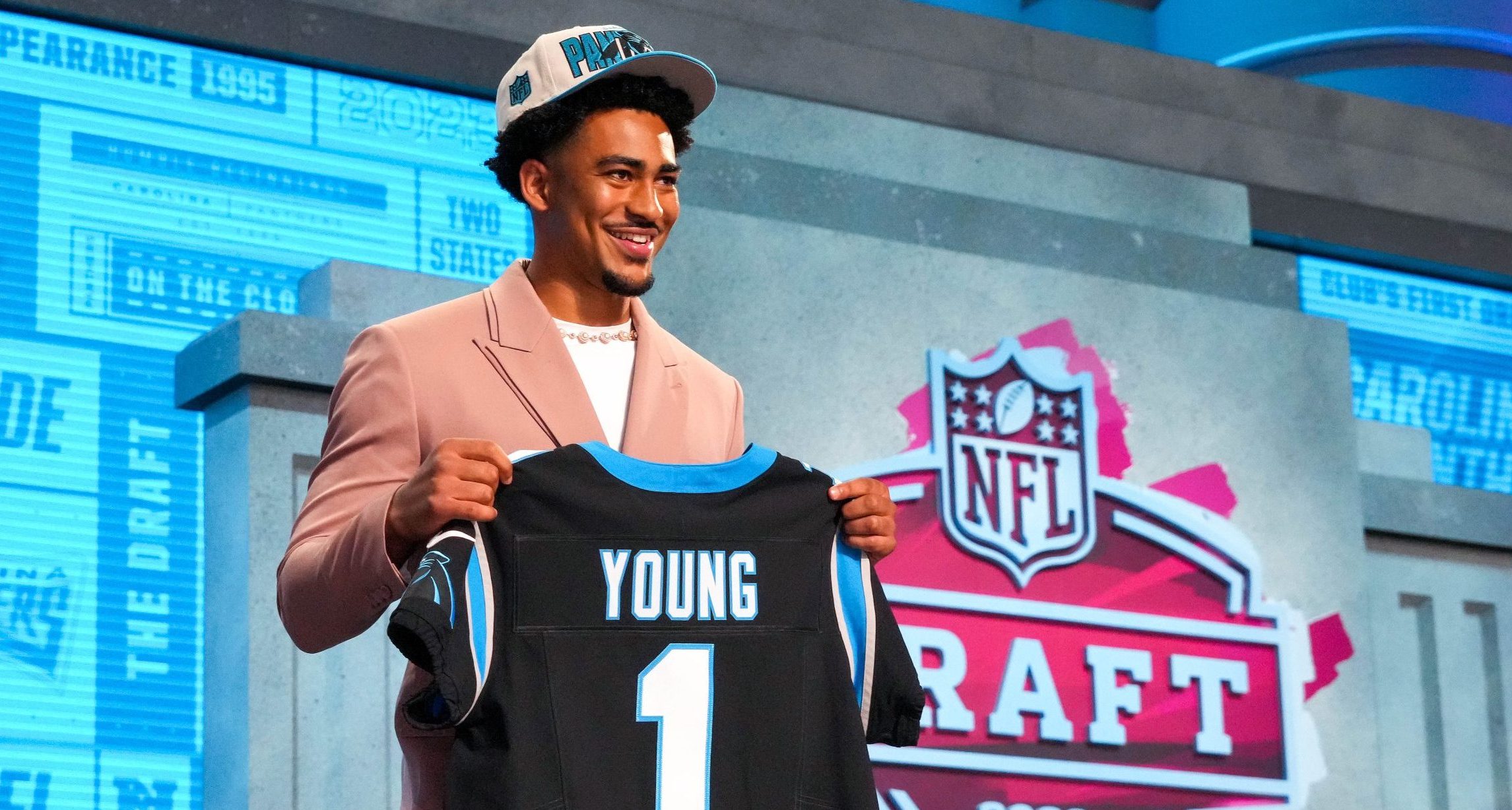 Alabama quarterback Bryce Young on stage after he was drafted first overall by the Carolina Panthers
