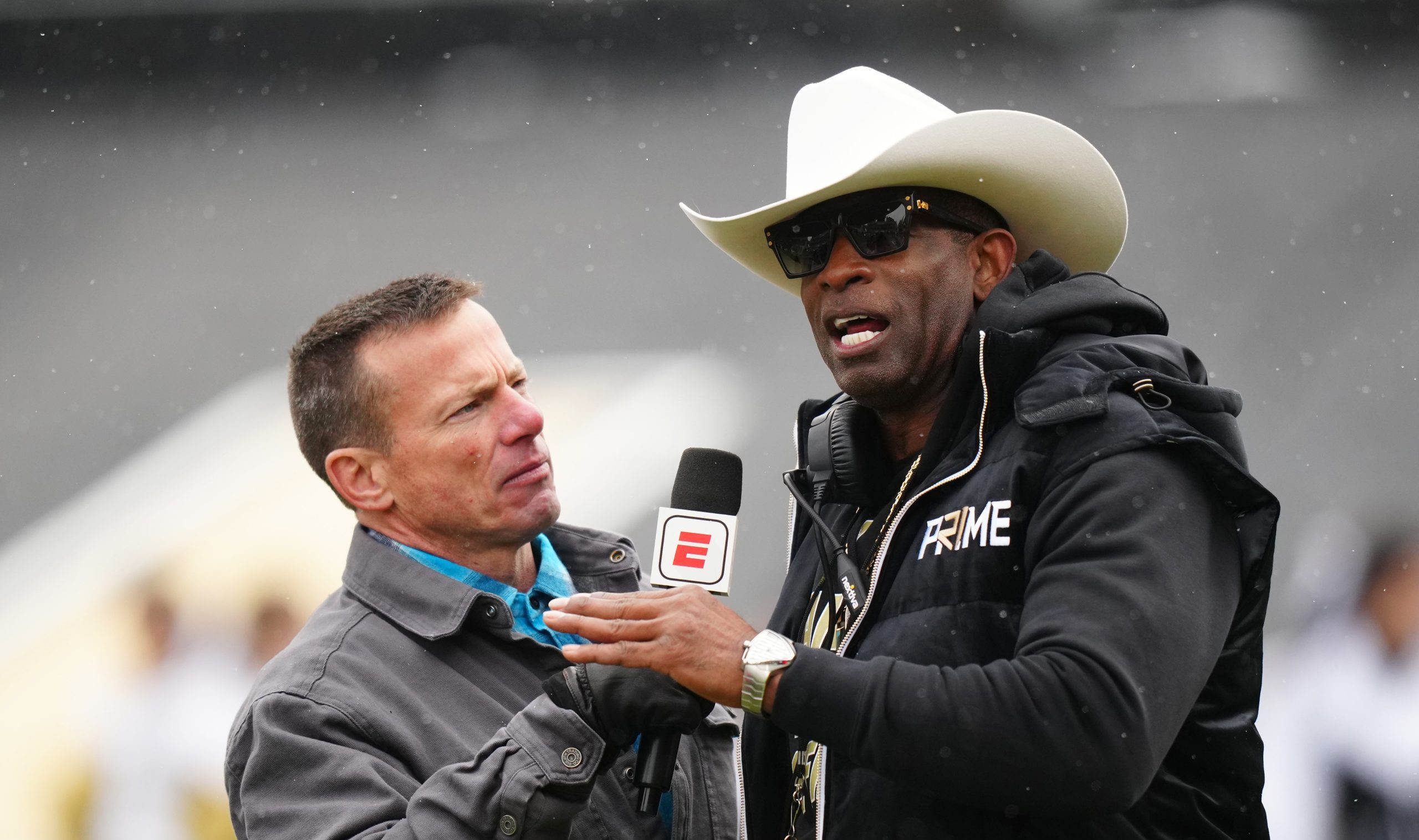 Apr 22, 2023; Boulder, CO, USA; Colorado Buffaloes head coach Deion Sanders is interviewed by ESPN broadcaster Quint Kessenich during the first half of a spring game at Folsom Filed. Mandatory Credit: Ron Chenoy-USA TODAY Sports