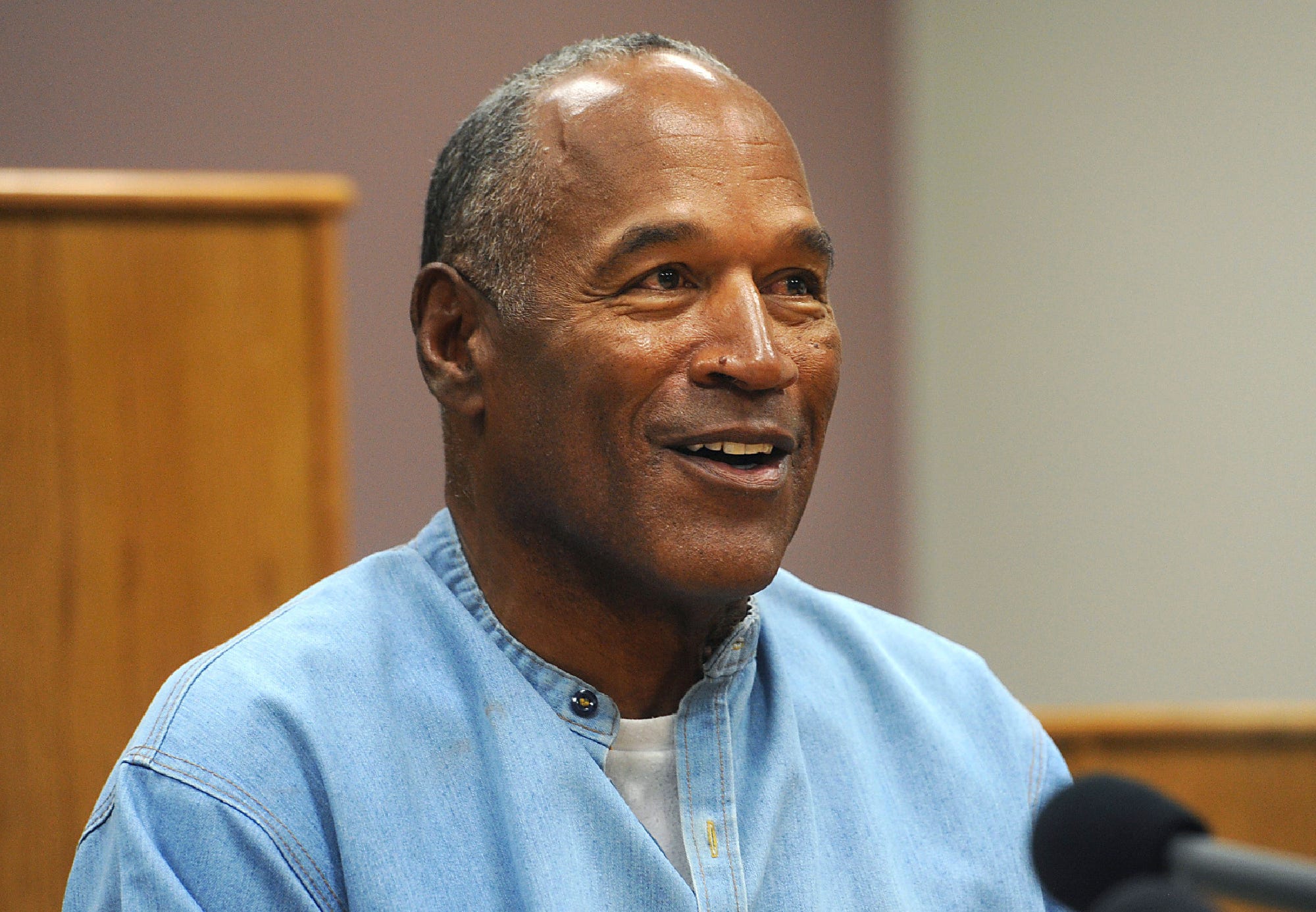 In this July 20, 2017, file photo, former NFL football star O.J. Simpson appears via video for his parole hearing at the Lovelock Correctional Center in Lovelock, Nev. The 74-year-old former football hero, acquitted California murder defendant and convicted Las Vegas armed robber was granted good behavior credits and discharged from parole effective Dec. 1, the day after a hearing before the Nevada state Board of Parole, Kim Yoko Smith, spokeswoman for the Nevada State Police, said Tuesday, Dec. 14, 2021.