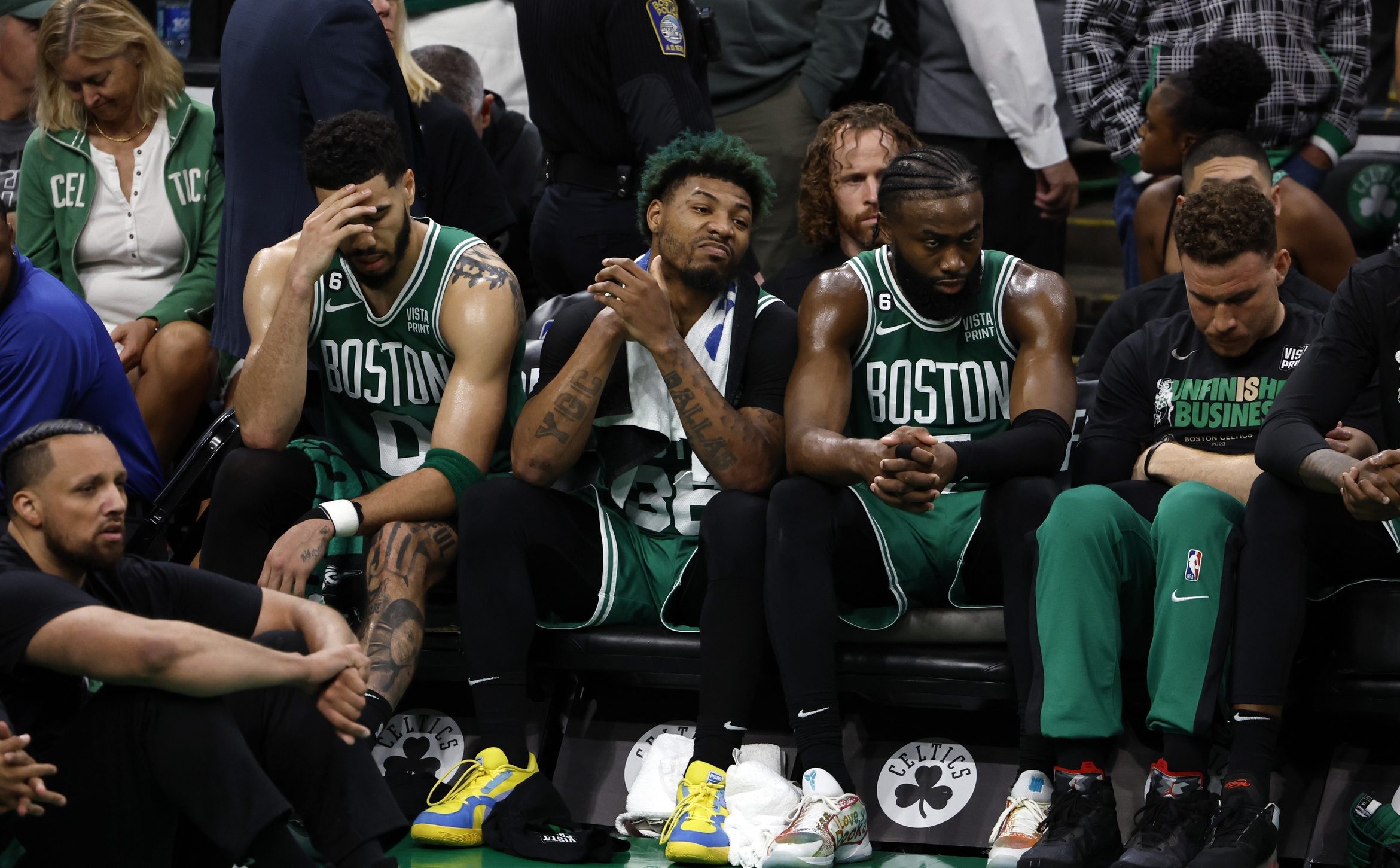 Marcus Smart alongside former Celtics teammates Jayson Tatum and Jaylen Brown.