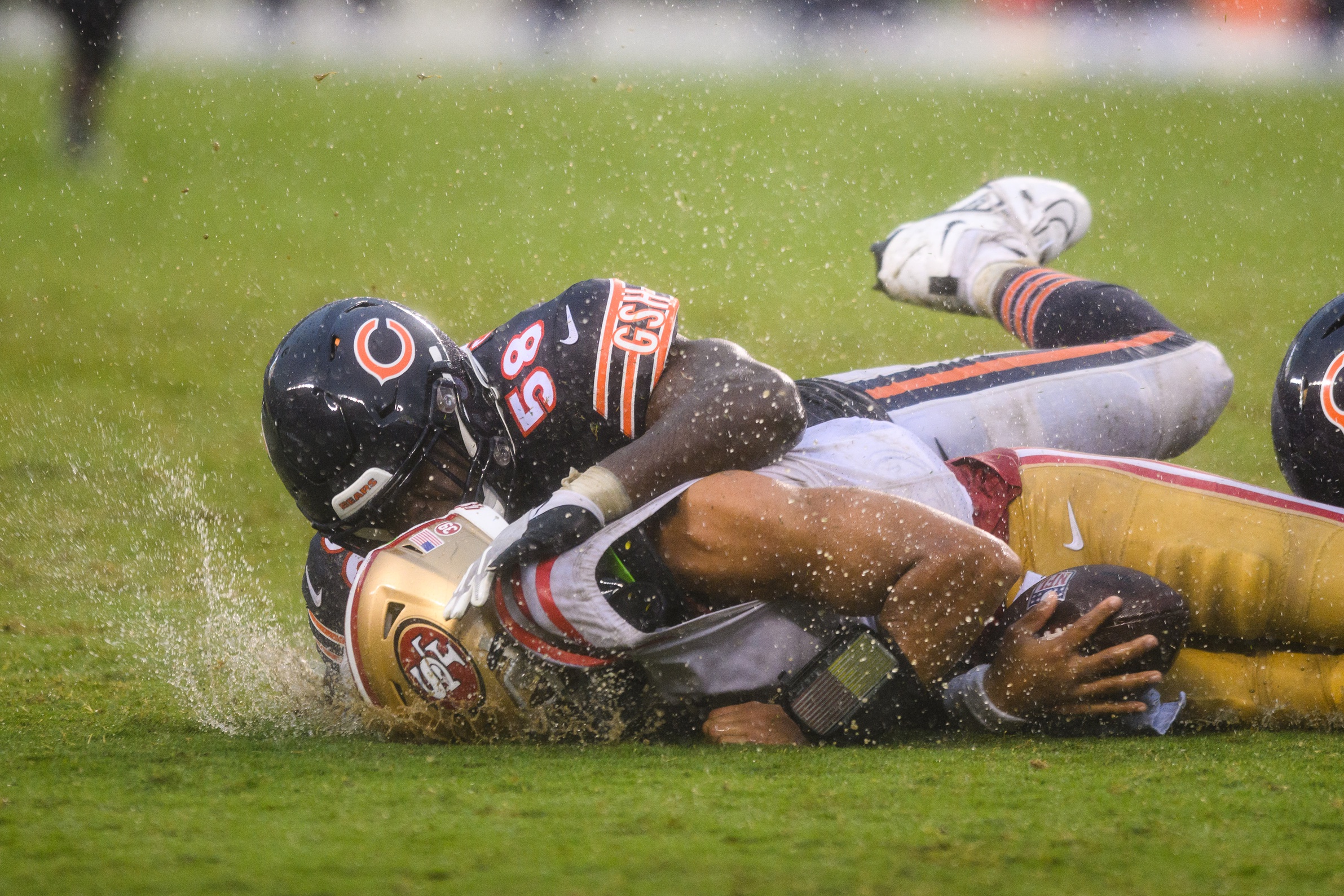 Sep 11, 2022; Chicago, Illinois, USA; San Francisco 49ers quarterback Trey Lance (5) is tackled after a run by Chicago Bears inside linebacker Roquan Smith (58) in the fourth quarter at Soldier Field. Mandatory Credit: Daniel Bartel-USA TODAY Sports