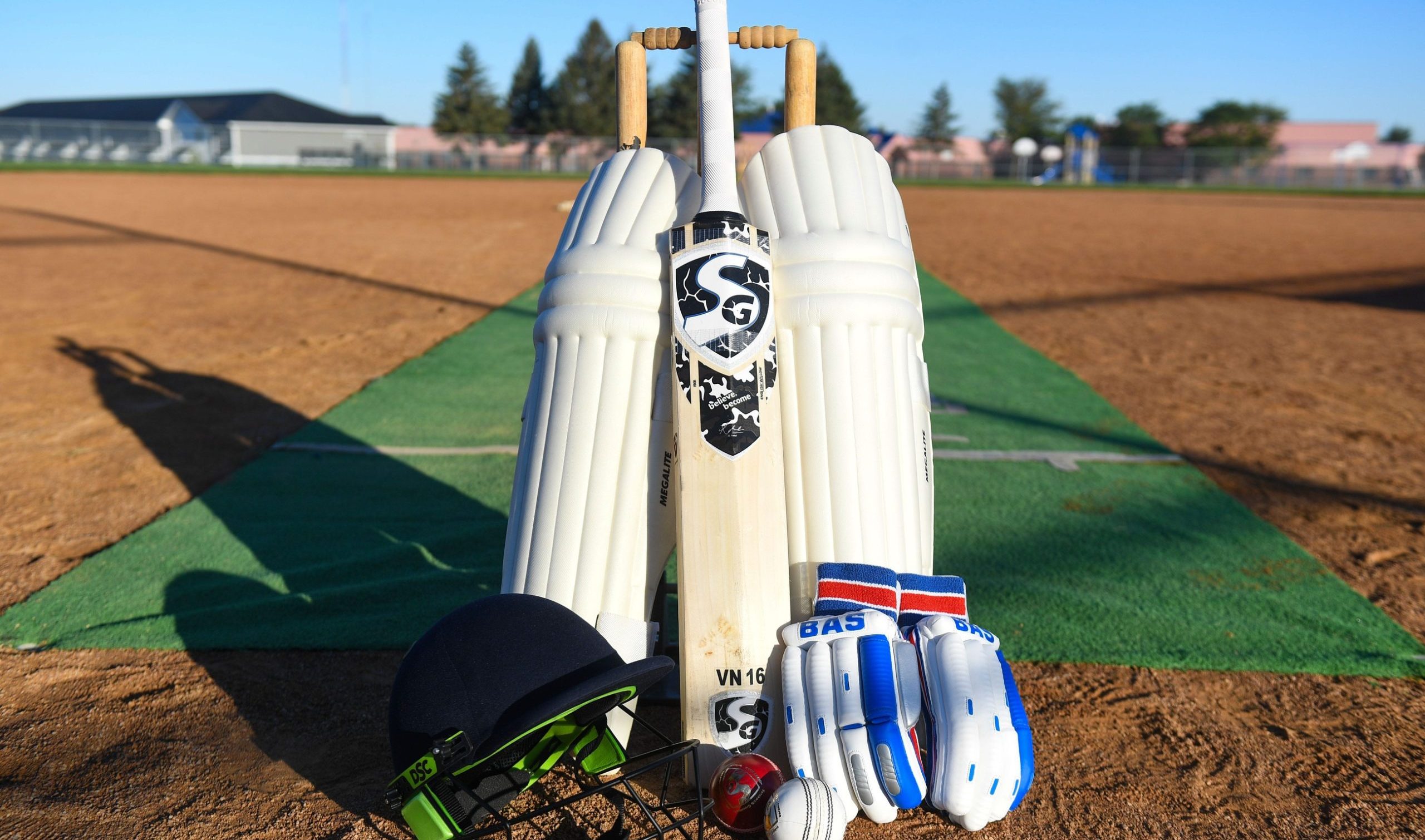Example of professional cricket equipment, including leg pads, a bat, a helmet, gloves and balls, are set up on Sunday, September 11, 2022, at Kenny Anderson Park in Sioux Falls.