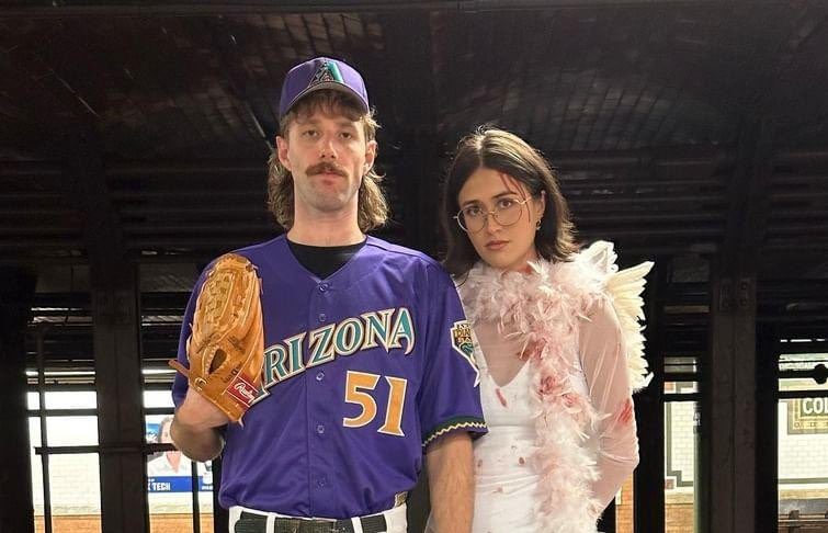 Randy Johnson's infamous bird-hitting pitch from 2001 inspired an incredible costume idea from a couple 22 years later.. Photo Credit: Twitter/X user @nothanksalex