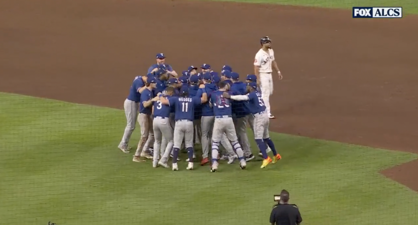 Texas Rangers celebrate after beating the Houston Astros in Game 7 of the ALCS.