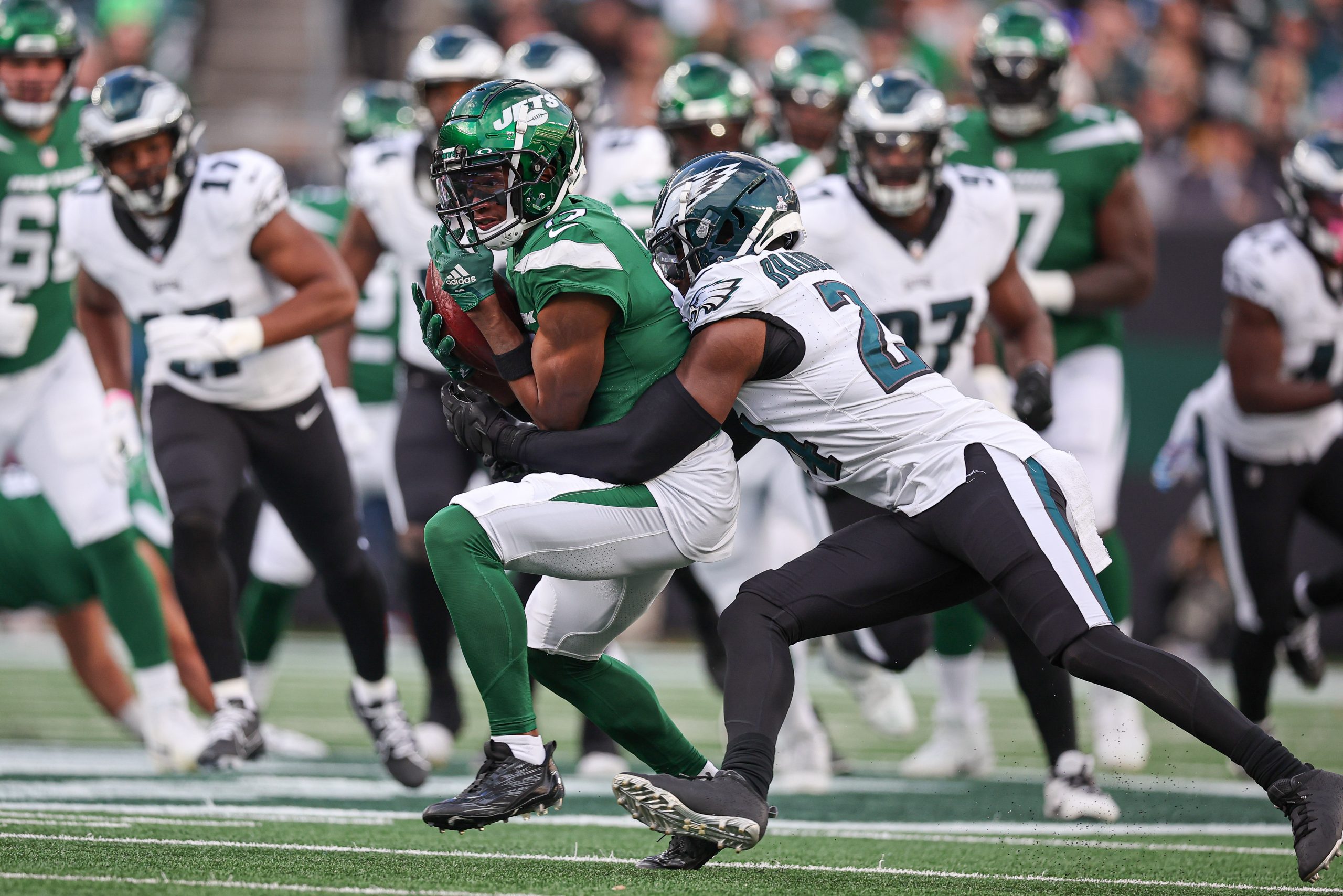 Jets star Garrett Wilson briefly left Sunday's game with an injury. And while he avoided disaster, he also bashed his home field's turf. Photo Credit: Vincent Carchietta-USA TODAY Sports