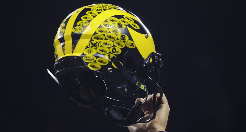 Dec 3, 2022; Indianapolis, Indiana, USA; A Michigan Wolverines player holds their helmet following their 43-22 victory against Purdue in the Big Ten Championship at Lucas Oil Stadium. Mandatory Credit: Trevor Ruszkowski-USA TODAY Sports