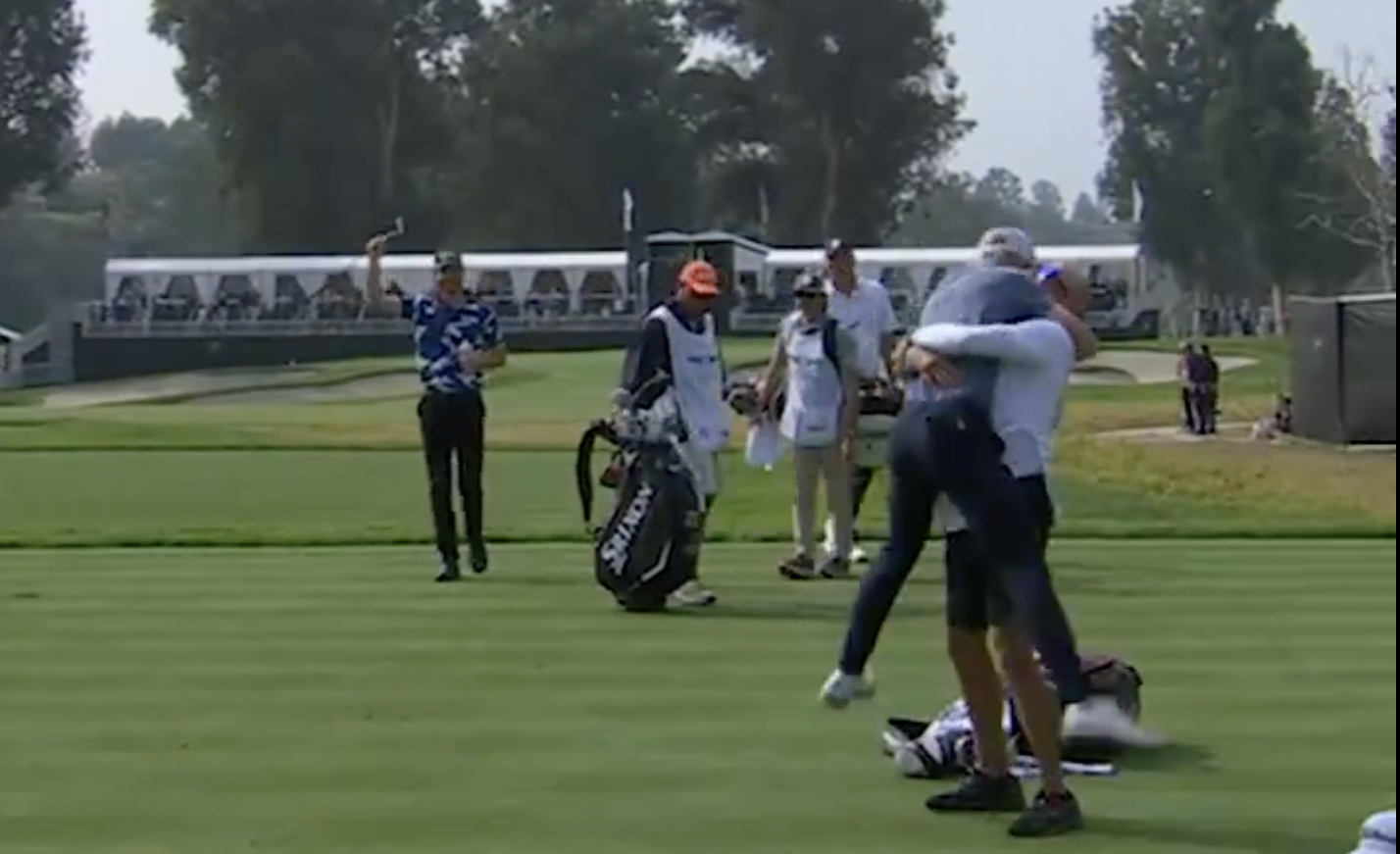 Will Zalatoris hugging his caddie after making a hole-in-one