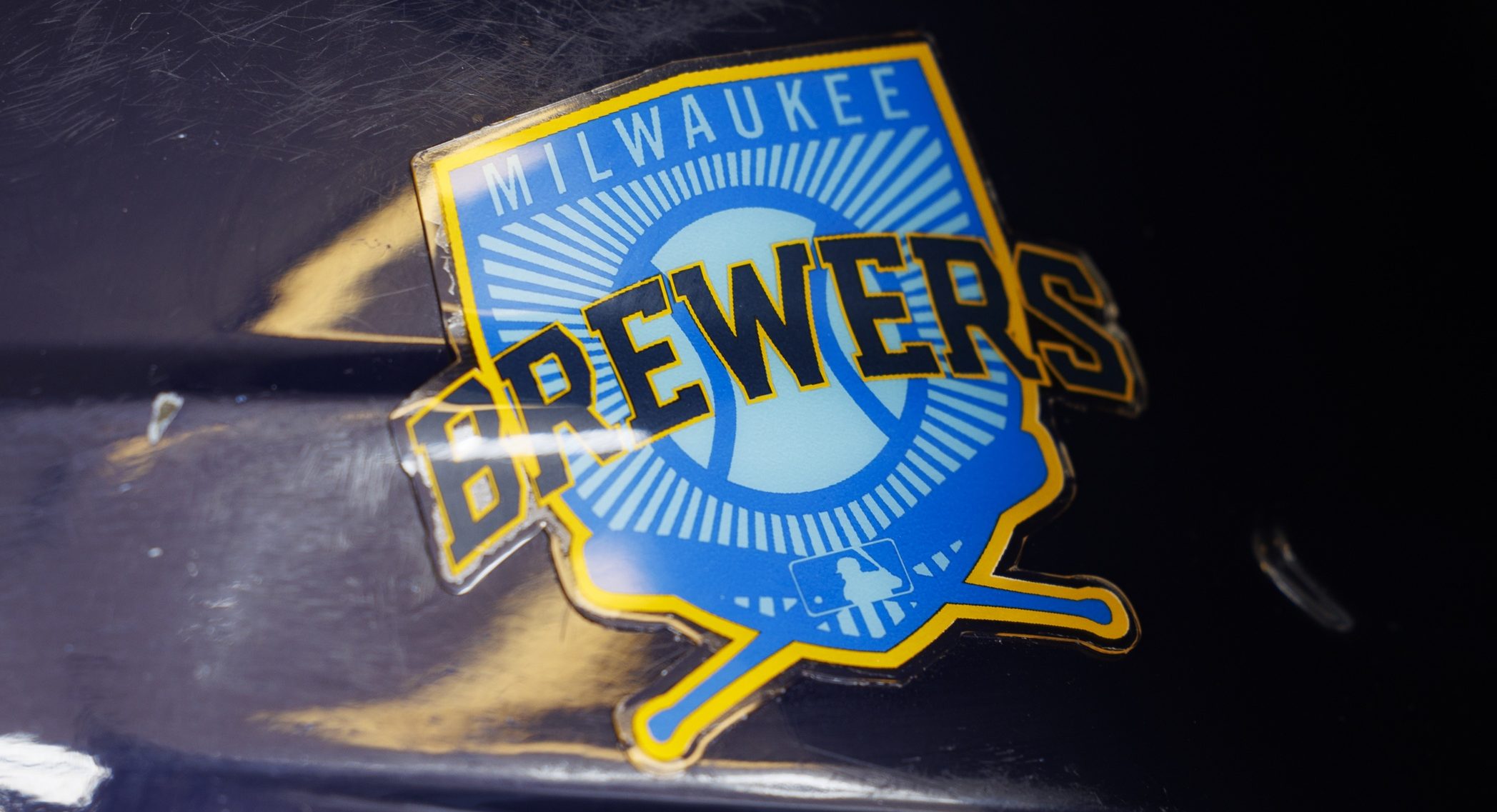 A Milwaukee Brewers logo on a batting helmet in the dugout prior to the game against the Pittsburgh Pirates at American Family Field.